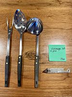 Full view of three utensils and opener laid out on table