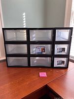 Front view showing all nine drawers and overall condition
