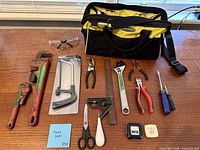All items laid out with bag and tools visible