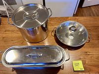 Top view showing stock pot with lid, sauté pan with lid, oval pan with lid