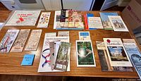 Overview of all folded maps, brochures and booklets spread on tabletop