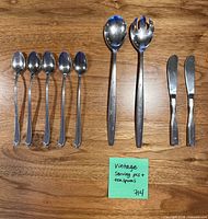 Overview of all 11 flatware pieces on table