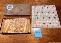 Set laid out showing board, tiles, racks and box