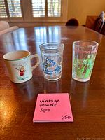 Front view of mug and both tumblers on table