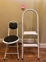 Front view of ladder and stool standing unfolded