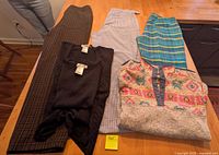 Overview of all five clothing items on table