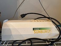 Exterior view of Hydrofarm Mini Sunburst grow light housing with power cord