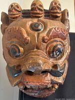 Frontal view showing entire mask, skull crown, eyes, teeth, paint