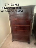 Full view of mahogany chest showing six drawers and carved columns