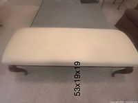 Top view of cream upholstered bench showing full seat surface with dimension label