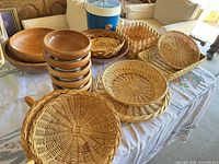 Group view of wooden bowls, wicker baskets, blue ice bucket