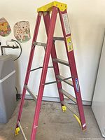 Full view of Werner red fiberglass step ladder