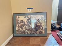 Full view of framed photograph leaning against wall