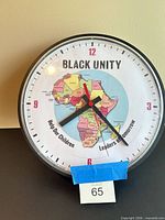 Front view of wall clock showing dial and graphics