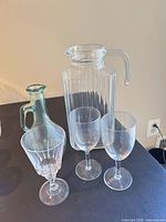 Group shot showing all five glass pieces: pitcher, carafe, two goblets, wine glass