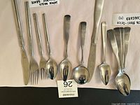 Overall view of mixed flatware laid out