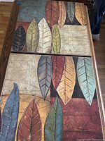 Both canvas panels side by side showing full leaf design and wood frames