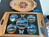 Both trays overview: Romanian carved oval above Rio graphic rectangular