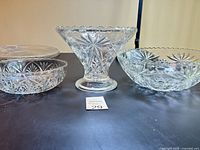 All four pressed glass pieces on table