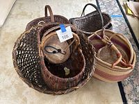 All seven baskets grouped together showing variety of shapes and colors