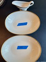Top view showing two oval bowls and gravy boat