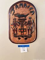 Front view of wooden Jamaican Coat of Arms plaque
