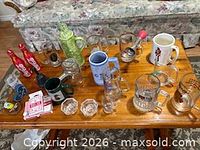 All items on wooden table showing overall lot composition