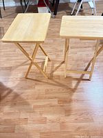 Both folding tray tables open, showing tops and legs