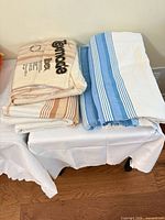 Three striped towels on small table