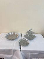 All three silver-tone aluminum serving pieces displayed together