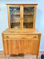 Full view of 2-piece hutch showing glass doors, drawer and lower cabinet