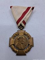 Obverse of medal showing bust and ribbon