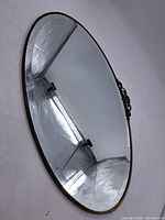 Full view of oval beveled mirror showing overall size and shape