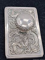 Top view showing dragon relief and knob