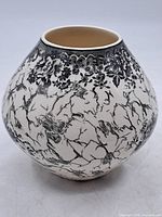 Full view of bulbous ceramic vase showing pattern and shape