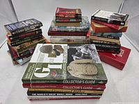 Three stacks of assorted WWII and military history books