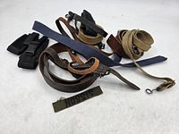 Group of assorted straps and name tape spread on surface