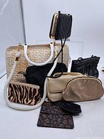 Overview of all nine purses and pouches