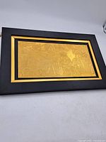 Full view of framed Wedgwood gilt plaque