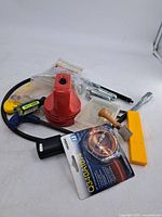Group shot of all tools, desk vacuum, hardware bags