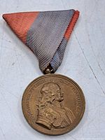 Obverse of medal showing portrait and inscription