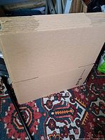Stack of flat corrugated cardboard boxes