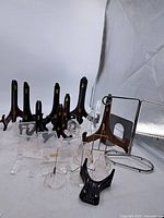 Group shot showing wood, acrylic, metal and plastic stands