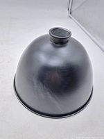 exterior view of black metal reflector shade