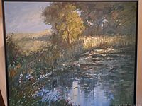 full view of framed oil painting showing marsh landscape