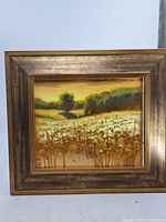 Front view of framed oil on panel landscape painting