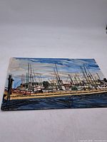 Full view of the watercolor painting depicting wharf and boats