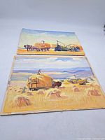 Both watercolour paintings laid flat