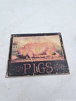 Front view showing pig image and lettering