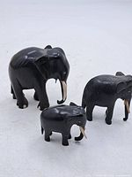 All three carved wooden elephants grouped
